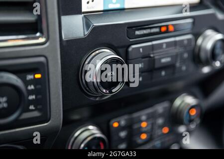 Car radio front volume closeup. Car radio controls. Modern car audio system. Interior Of Luxury Car Stock Photo