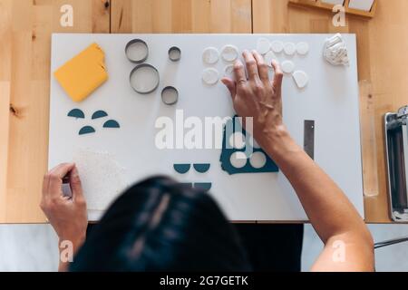 Creating Jewelry in Wooden Table Stock Photo