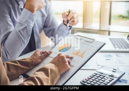Partner meeting of business people colleagues consultation and discussion marketing plan meeting concept on financial report and analyzing investment Stock Photo
