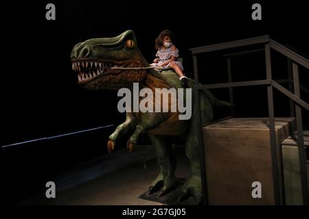 Haifa, Israeli city of Haifa. 13th July, 2021. A girl visits an exhibition of dinosaurs at Madatech, Israel's National Museum of Science, Technology and Space, in the northern Israeli city of Haifa, July 13, 2021. Credit: Gil Cohen Magen/Xinhua/Alamy Live News Stock Photo