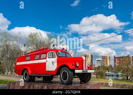 KRASNODAR - MAY 21, 2021: Fire Car Zil from Soviet time, Fire Engine Retro Soviet Car Oldtimer at Krasnodar, background blue cloudy sky Stock Photo