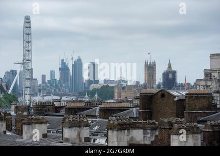 London, UK.  14 July 2021.  The view from the roof of Somerset House of the London Eye and Houses of Parliament at a photocall for the new DODGE ride at Somerset House.    Credit: Stephen Chung / Alamy Live News Stock Photo