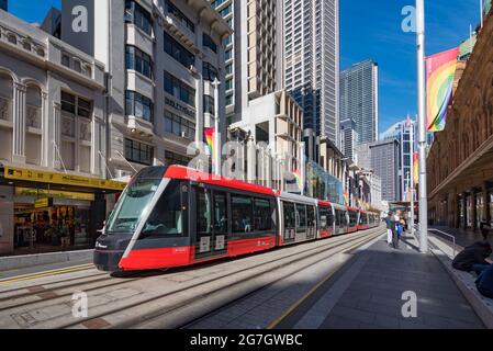 May 2021:Close to the Queen Victoria Building, one of Sydney City's light rail trams on George Street travelling between Randwick and Circular Quay Stock Photo