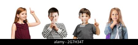 Art collage made of portraits of little and happy kids isolated on white studio background. Human emotions, facial expression concept Stock Photo