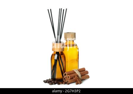 Diffusers, coffee beans and cinnamon sticks isolated on white background Stock Photo