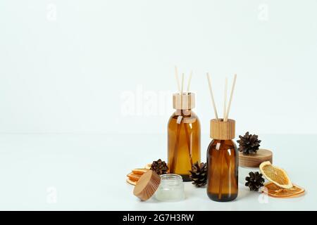 Diffusers, lemons and cones on white background Stock Photo
