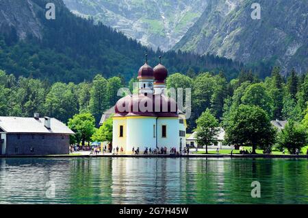 Berchtesgaden, Germany - June 12th 2015: Unidentified people around the pilgrimage church Saint Bartholomew on Koenigssee lake, reachable only by boat Stock Photo