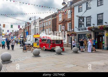 HIgh Wycombe, England - July 9th 2021: People and food trucks in the High Street. HIgh Wycombe is a majot town in  Buckinghamshire, England, United Ki Stock Photo