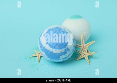 Bath balls and starfishes on blue background Stock Photo