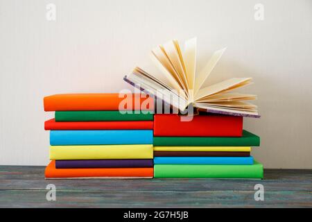 Opened Book on a pile of books, good copy space Stock Photo
