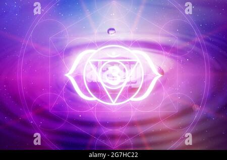 Ajna Chakra symbol on a purple background. This is the sixth Chakra, also called The Third Eye Chakra Stock Photo