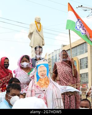 Rajasthan, India. 14th July, 2021. Congress party activists with an effigy of Indian Prime Minister Narendra Modi during protest against Central's Modi Government over high inflation and rising prices of petrol, diesel and cooking gas cylinder at Mahatma Gandhi circle in Beawar. (Photo by Sumit Saraswat/Pacific Press) Credit: Pacific Press Media Production Corp./Alamy Live News Stock Photo