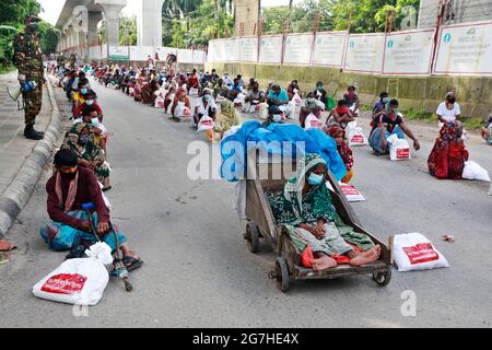 Dhaka, Bangladesh - July 14, 2021: The food items saved from the rations allotted to the members of the Bangladesh Army were distributed among more th Stock Photo