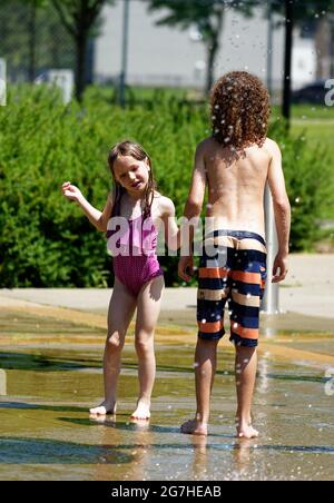 playing in water games and fountains in Quebec City, Canada Stock Photo