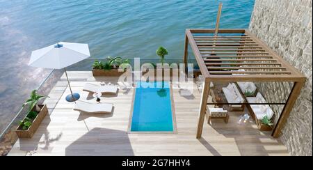 3D illustration of luxury contemporary outdoor wooden patio with swimming pool next to lake. Top view of deck chairs with umbrella and fruit cocktails Stock Photo