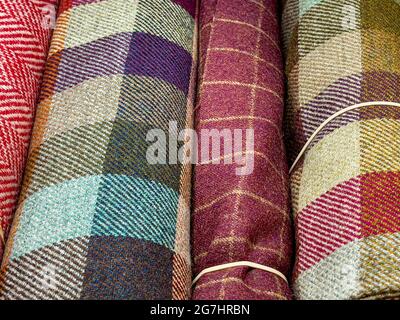 Bolts of checked woollen cloth in a haberdashery. Stock Photo