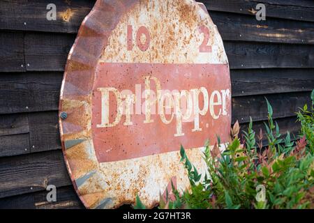 Vintage Dr. Pepper bottle cap tin sign at Crazy Mule Arts & Antiques in Lula, Georgia. (USA) Stock Photo