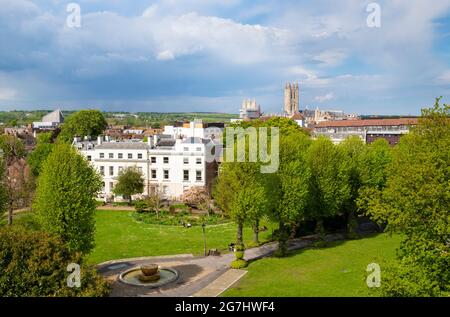 Canterbury cathedral view from Dane John Mound in Dane John Gardens with the Font Fountain and Marlowe avenue houses Canterbury Kent England UK GB Stock Photo