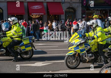 LONDON - MAY 29, 2021: British police motorcyclists at a Freedom for Palestine protest rally in London Stock Photo