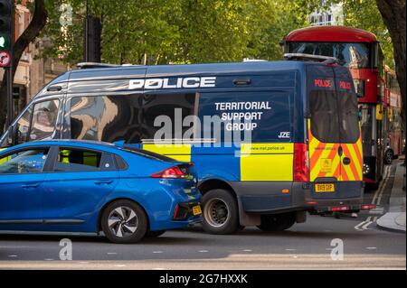LONDON - MAY 29, 2021: A Police Territorial Support Group van in traffic on a London street Stock Photo