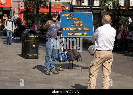 Man preaching the religion of Christianity in Leicester Square on 2nd July 2021 in London, United Kingdom. Stock Photo