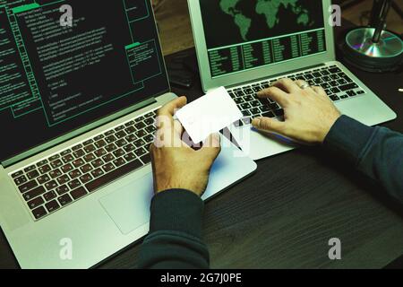Close up of programmer of hacker hands typing a code Stock Photo
