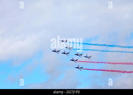 Paris, France - July 14 2021: The French Air Patrol (French: Patrouille de France) performing a demonstration to celebrate the Bastille Day. Stock Photo