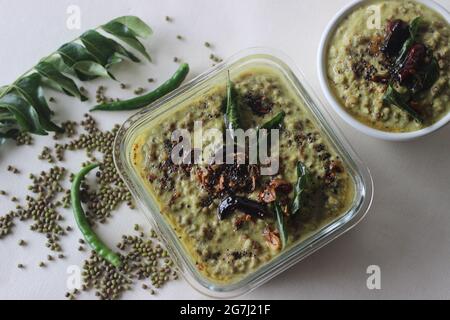 Green gram curry. Boiled green gram cooked in a paste of grated coconuts, shallots and green chilies. Popularly known as moong dal curry. Shot on whit Stock Photo