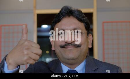 Closeup shot of an Indian successful businessman Stock Photo