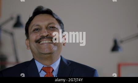 Closeup shot of an Indian successful businessman Stock Photo