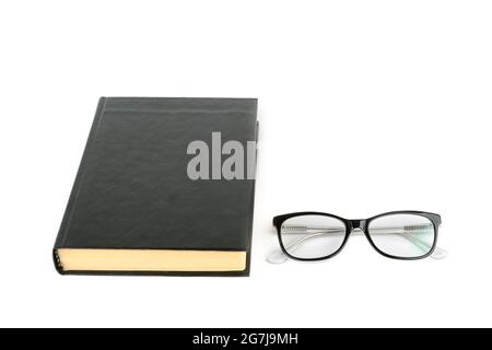 Book and glasses isolated on white background. All objects are black. Free space for text. Stock Photo