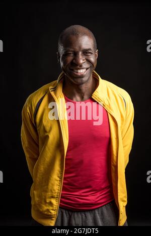 Portrait of an African American man standing looking at the camera and smiling Stock Photo
