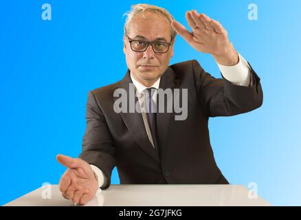 businessman with open arms looking confidently in front with blue background Stock Photo