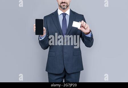 cyber monday. manager showing smartphone. man pay in online banking. online money. credit or debit card. businessman hold business card. fast phone pa Stock Photo