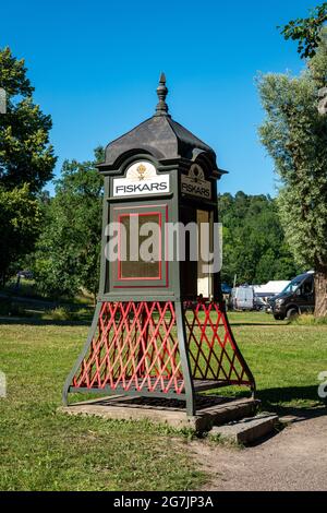 Old telephone booth in Fiskars village of Raasepori, Finland Stock Photo