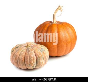 Two pumpkins of different varieties and shapes isolated on a white background. Healthy food. Stock Photo