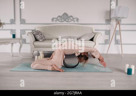healthy woman starting her morning with yoga and relaxation Stock Photo