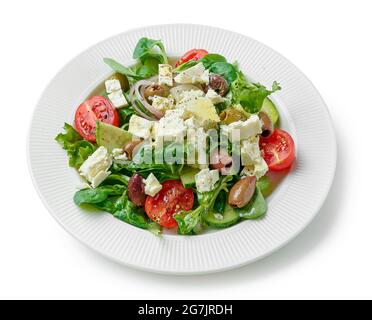 plate of fresh vegetable salad with greek cheese isolated on white background Stock Photo