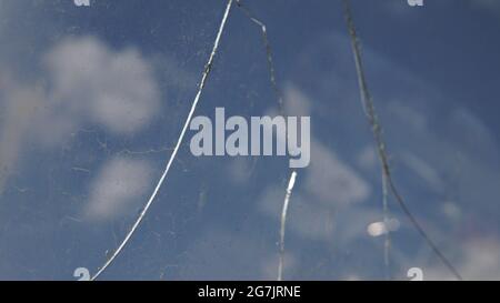 Closeup shot of a broken window on a car in a junkyard Stock Photo