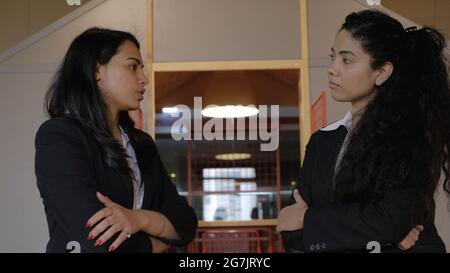 Female colleagues having a discussion during the break Stock Photo