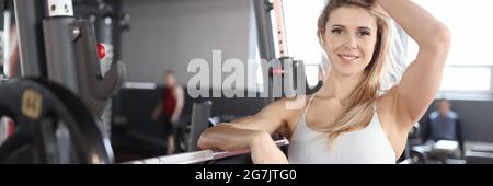 Young woman athlete stands in the gym Stock Photo