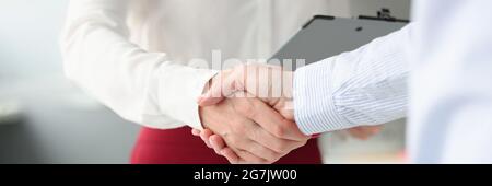 Business people shake hands in handshake closeup Stock Photo
