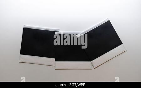Three blank retro photo frames on white background. Stock Photo