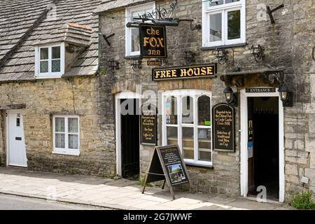 Corfe Castle, Dorset, England - June 2021: Entrance to The Fox Inn, a small traditional pub in one of the streets of the village of Corfe Castle.. Stock Photo