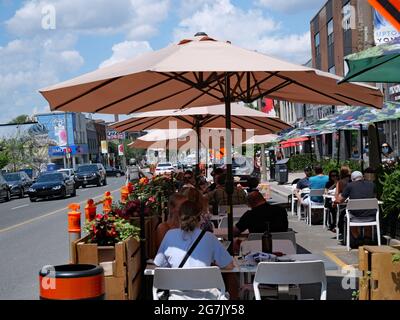 Part of the road is taken over by restaurants on Yonge Street in  Toronto, as outdoor dining is safer during the pandemic. Stock Photo