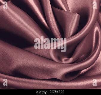 Smooth elegant pink silk or satin luxury cloth texture can use as abstract background. Luxurious background design Stock Photo