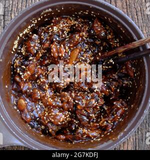 Raw material for homemade food, tamarind paste cook with sugar and sesame to make delicious snacks food, ripe tamarinds rich vitamin can make sauce Stock Photo