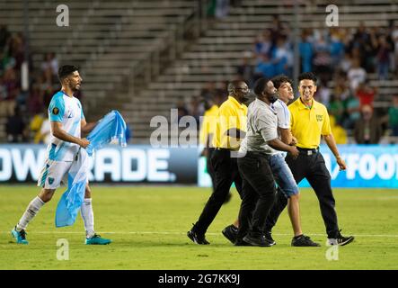 Dallas, Texas, USA. 14th July, 2021. Fan being walked off the field. Credit: Hoss McBain/ZUMA Wire/Alamy Live News Stock Photo