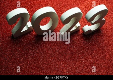 2023 Happy New Year with space copy on red glitter background Stock Photo