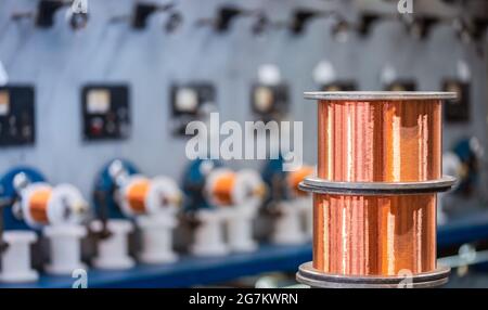 Production of copper wire, bronze cable in reels at factory Stock Photo